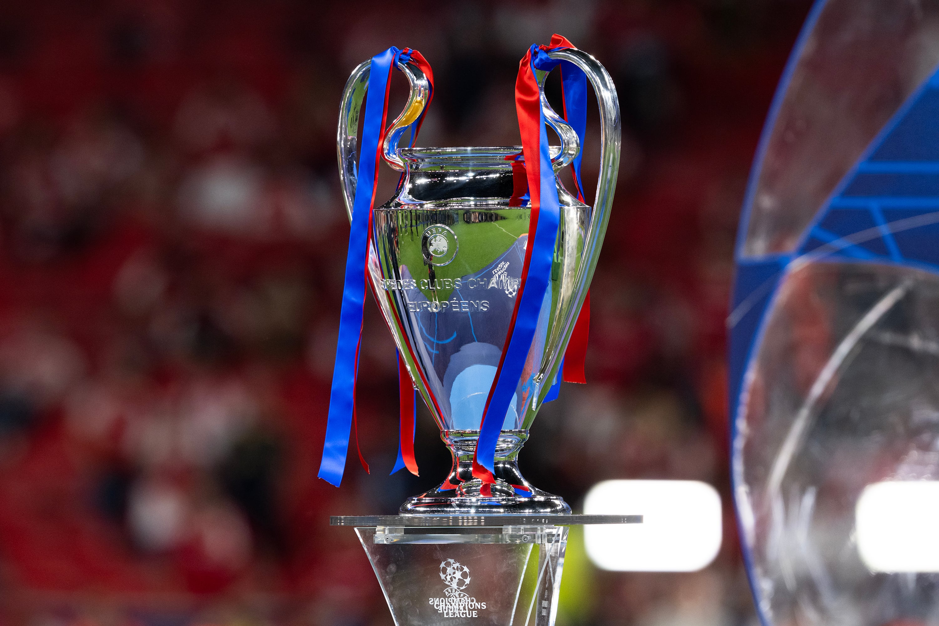 BUDAPEST, HUNGARY - MAY 30: The UEFA Champions League Trophy is displayed with red and blue ribbons for Paris Saint-Germain following the UEFA Champions League Final 2026 match between Paris Saint-Germain and Arsenal FC at Puskas Arena on May 30, 2026 in Budapest, Hungary. (Photo by Will Palmer/Sports Press Photo/Getty Images)
