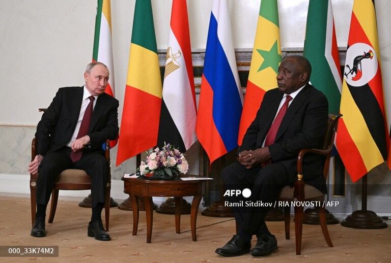 This handout photograph taken and released by RIA Novosti on June 17, 2023, shows Russian President Vladimir Putin (L) and South Africa's President Cyril Ramaphosa (R) during their meeting at the Constantine (Konstantinovsky) Palace in Strelna, outside Saint Petersburg. (Photo by Ramil Sitdikov / RIA NOVOSTI / AFP)