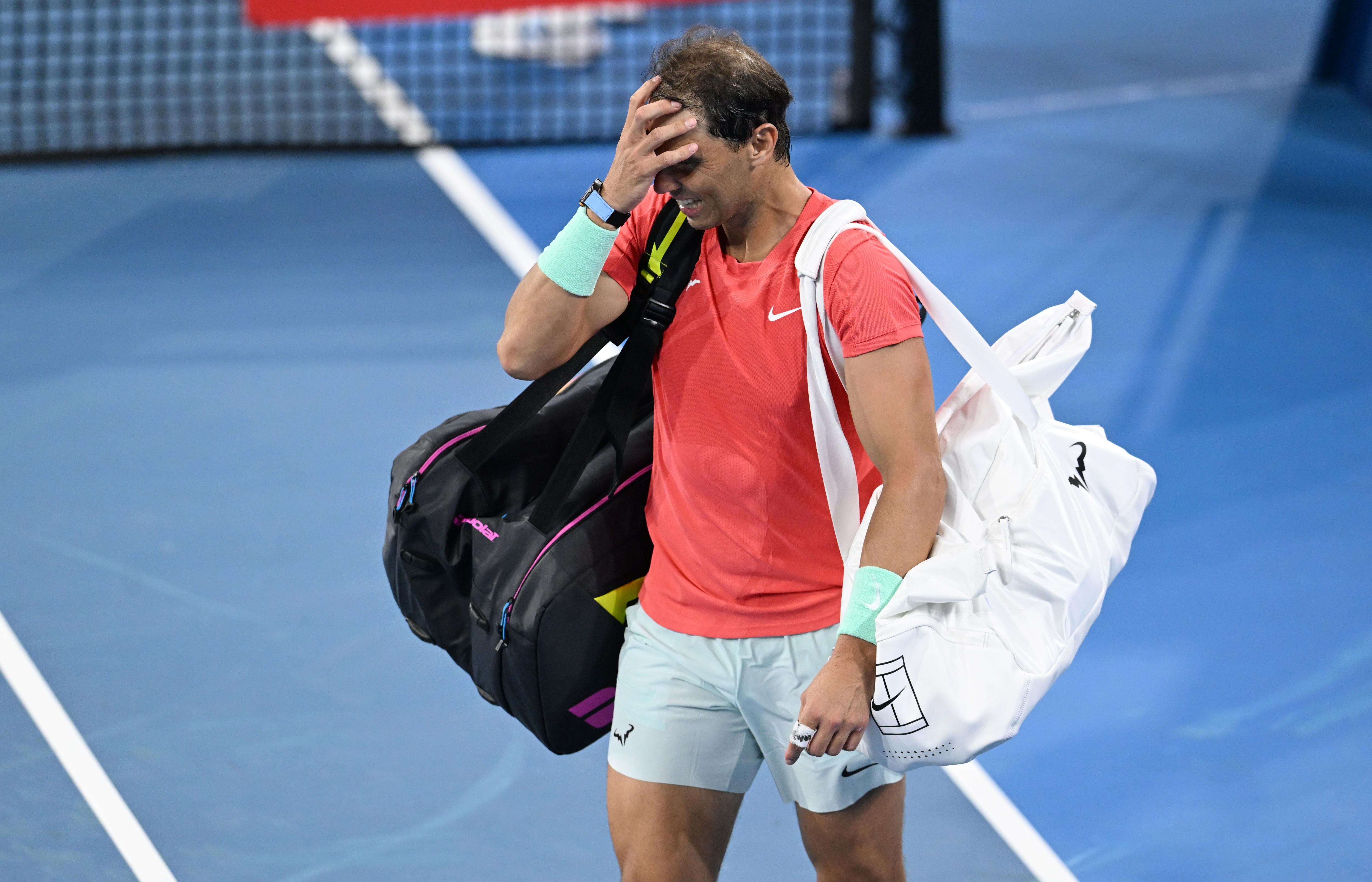 Brisbane (Australia), 31/12/2023.- Rafael Nadal of Spain reacts after losing his doubles match with partner Marc Lopez of Spain against Max Purcell and Jordan Thompson of Australia during their round of 32 doubles match on Day 1 of the 2024 Brisbane International at the Queensland Tennis Centre in Brisbane, Australia, 31 December 2023. (Tenis, Jordania, España) EFE/EPA/DARREN ENGLAND AUSTRALIA AND NEW ZEALAND OUT