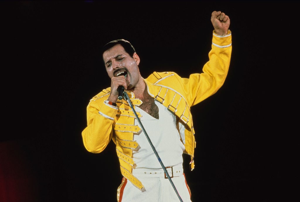 British singer-songwriter Freddie Mercury performing with Queen at Wembley Stadium, London, July 1986. The band played two nights at the venue, as part of the Magic Tour, on the 11th and 12th July. (Photo by Dave Hogan/Hulton Archive/Getty Images)