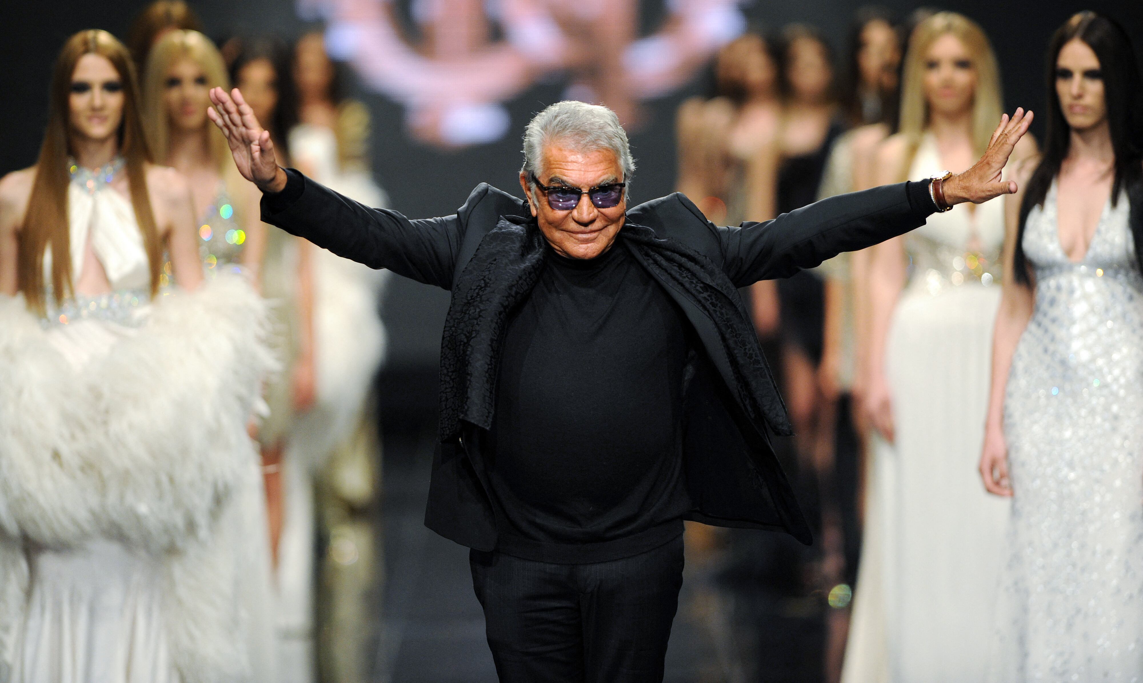 (FILES) Italian fashion designer Roberto Cavalli attends his fashion show on late evening on June 10, 2013, in the Montenegrin coastal town of Budva. - Italian fashion designer Roberto Cavalli has died at 83, Italian medias announced on April 12, 2024. (Photo by SAVO PRELEVIC / AFP)