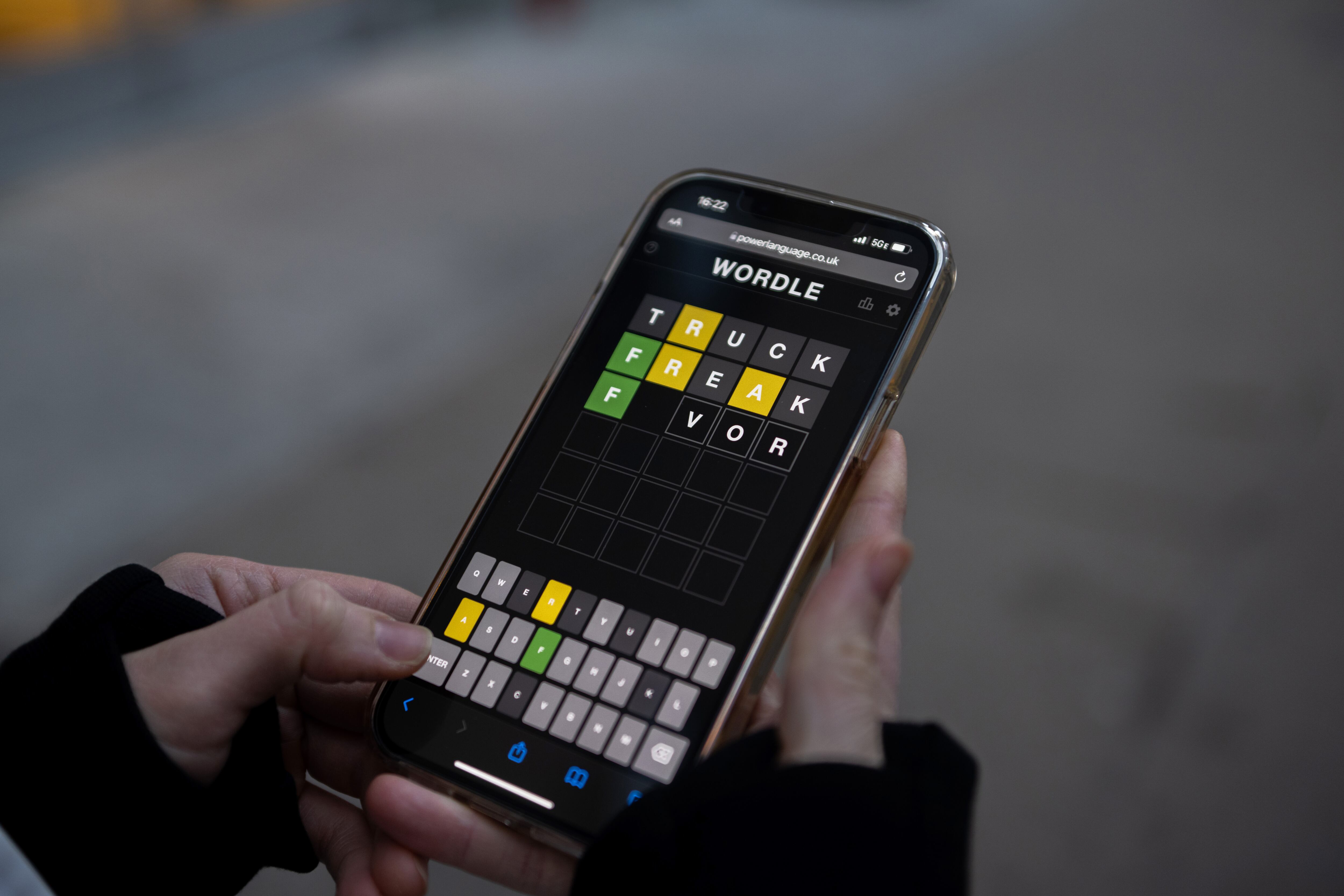 NEW YORK, NEW YORK - JANUARY 12: A friend of the photographer plays "Wordle" on January 12, 2022 in New York City. Created by Josh Wardle, Wordle, which is a spin off his name,  is a five letter word guessing game that gives the user six tries to guess the word correctly and is changed daily. It gained traction worldwide in October but recently grew even larger, with more than 2.7 million users according to NPR's Morning Edition. It features a coded way of sharing how many tries a user needed to guess correctly, using a yellow, green, and black square system when sharing it with friends or social media. (Photo by Alexi Rosenfeld/Getty Images)