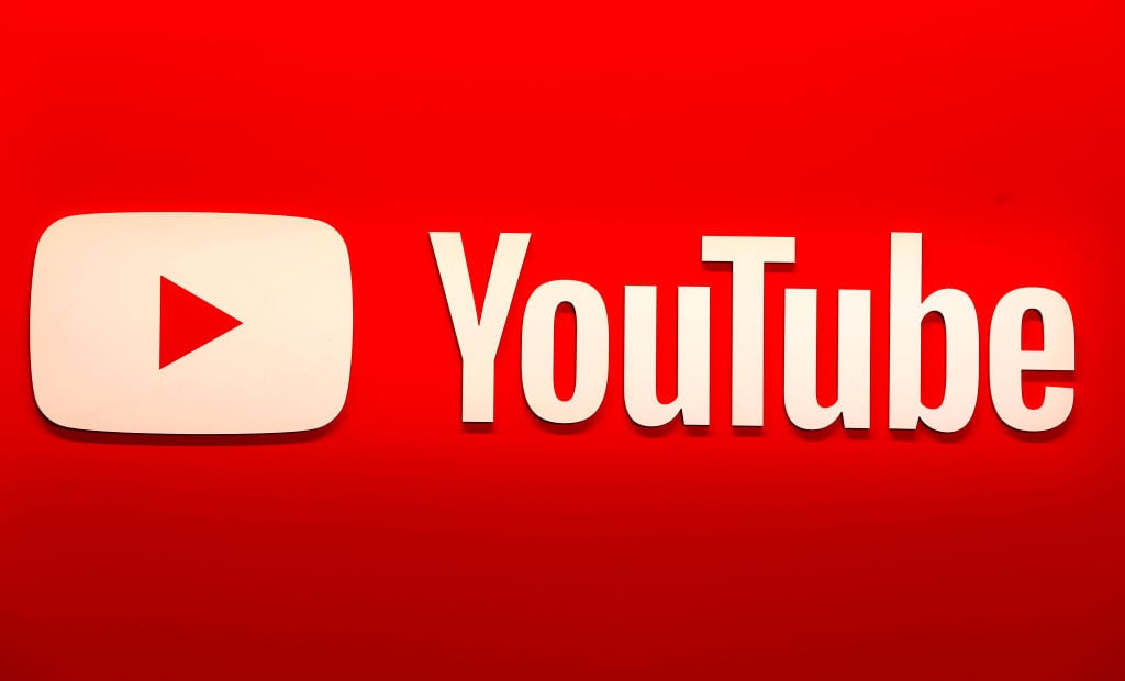 PARIS, FRANCE - OCTOBER 15: The YouTube logo of the video hosting and social media website is displayed during the "Mondial de l'Auto" at Parc des Expositions on October 15, 2024 in Paris, France. The 90th Paris Motor Show 2024 opened its doors on Monday, against the backdrop of the automotive crisis, due to the electrification of the European sector and competition from Chinese carmakers. The event is open to the public from October 15 to 20 at Paris Expo Porte de Versailles (Photo by Chesnot/Getty Images)