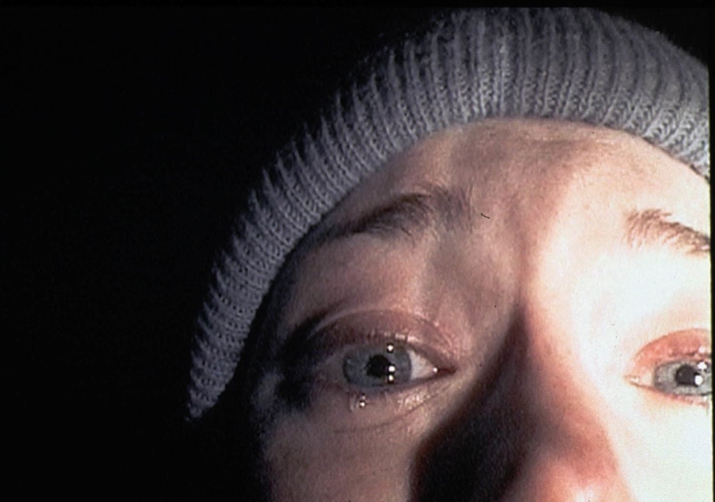 372697 03: Heather Donahue turns the camera on herself during a harrowing five-day journey through the Black Hills Forest in the low-budget thriller "The Blair Witch Project." The film, a mock documentary, is about three students who trek into Maryland's Black Hills to shoot a documentary about a local legend, "The Blair Witch." (Photo by Artisan Entertainment