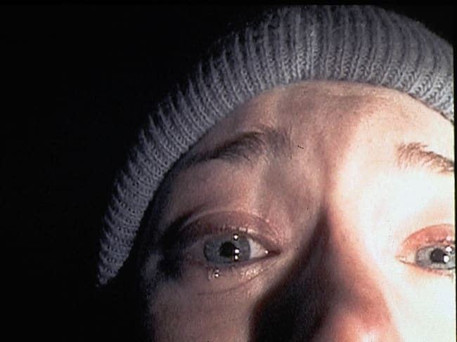 372697 03: Heather Donahue turns the camera on herself during a harrowing five-day journey through the Black Hills Forest in the low-budget thriller "The Blair Witch Project." The film, a mock documentary, is about three students who trek into Maryland's Black Hills to shoot a documentary about a local legend, "The Blair Witch." (Photo by Artisan Entertainment