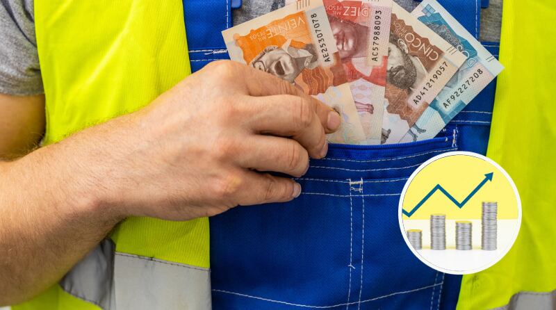 Trabajador contando sus ganancias, dinero de Colombia y en un círculo aumento de inflación. (Fotos vía Getty Images)