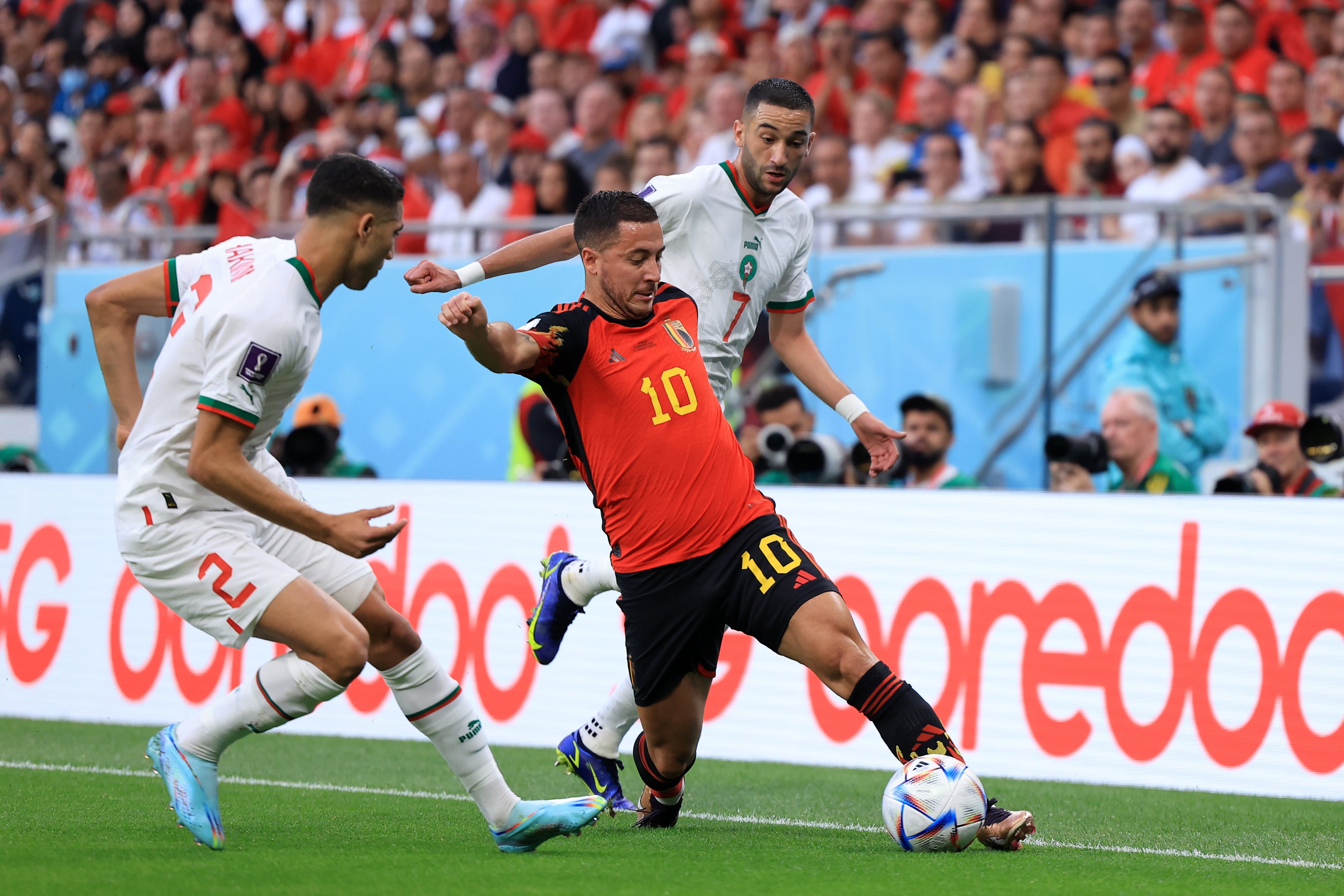DOHA, QATAR - NOVEMBER 27: Eden Hazard of Belgium controls the ball against Achraf Hakimi (L) and Hakim Ziyech of Morocco  during the FIFA World Cup Qatar 2022 Group F match between Belgium and Morocco at Al Thumama Stadium on November 27, 2022 in Doha, Qatar. (Photo by Buda Mendes/Getty Images)