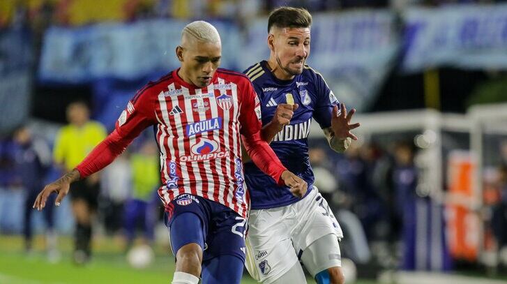 Jermein Peña del Junior y Santiago Giordana de Millonarios / Colprensa