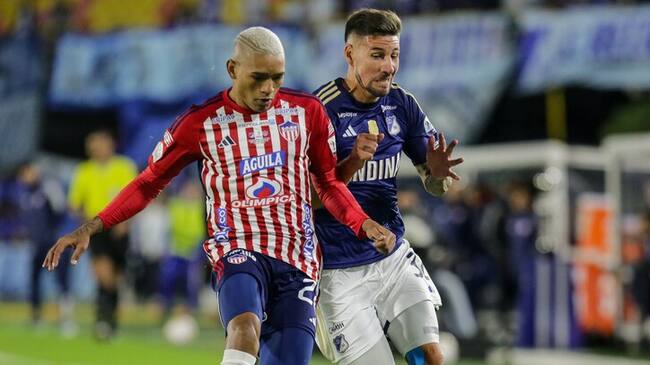 Jermein Peña del Junior y Santiago Giordana de Millonarios / Colprensa