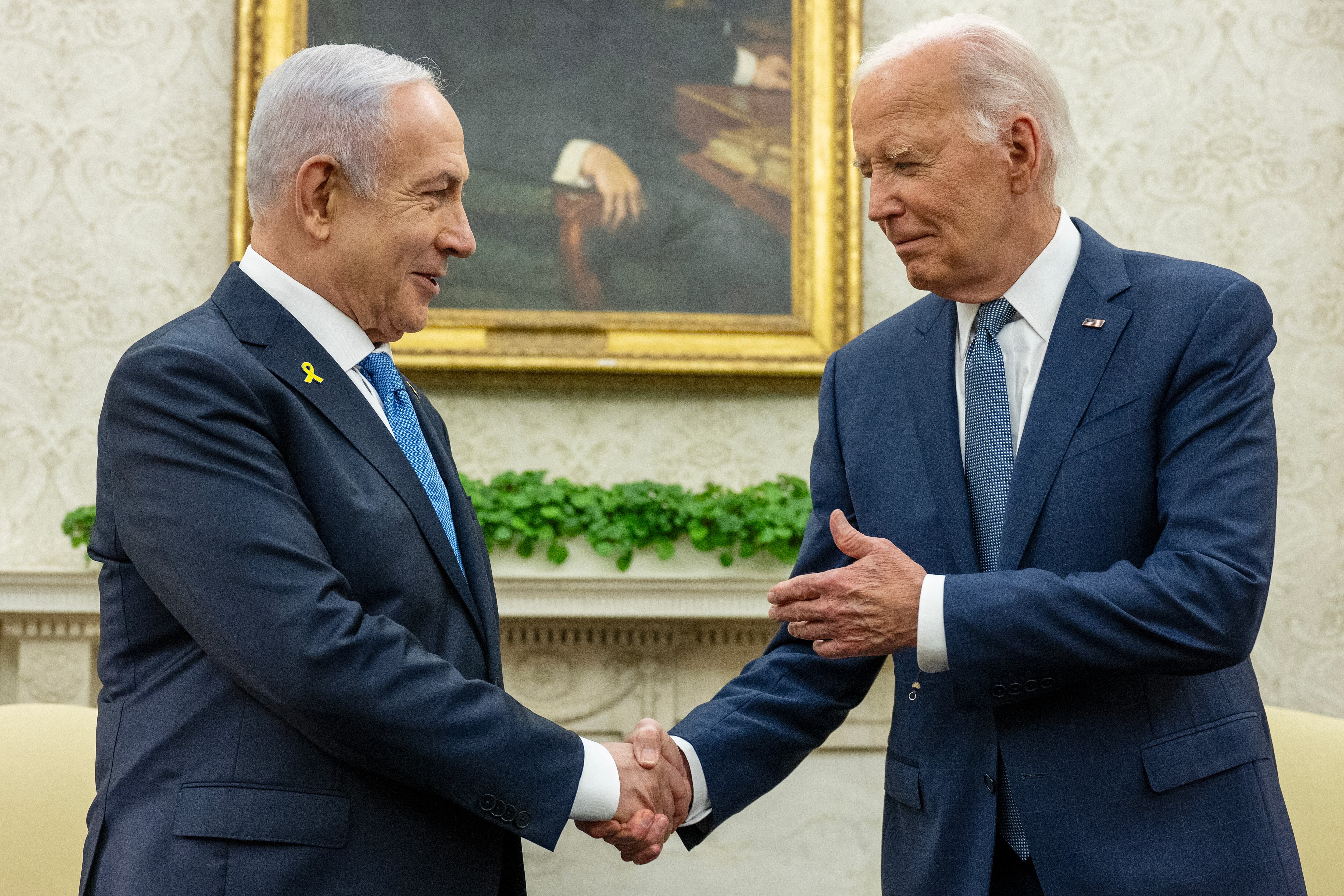US President Joe Biden (R) shakes hands with Israeli Prime Minister Benjamin Netanyahu during a meeting in the Oval Office of the White House in Washington, DC, on July 25, 2024. (Photo by Jim WATSON / AFP)