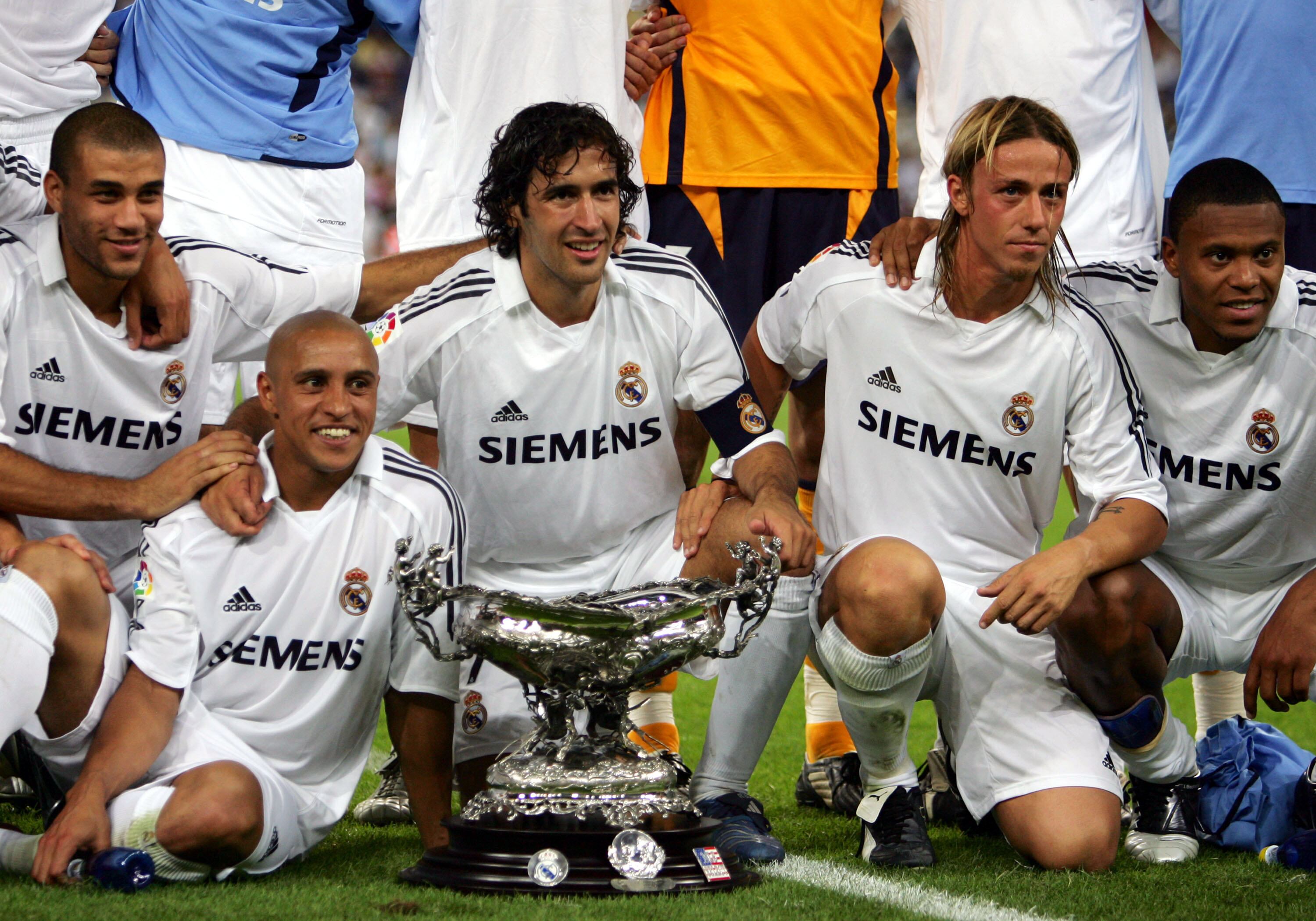 MADRID, SPAIN - AUGUST 23:  (2ndL-R) Real Madrid's Roberto Carlos, Raul Gonzalez, Jose Maria Gutierrez Hernandez and Julio Baptista pose with the Santiago Bernabeu trophy after beating a U.S. Major League Soccer all-star selection 5-0 at the Bernabeu on August 23, 2005 in Madrid, Spain. (Photo by Denis Doyle/Getty Images)