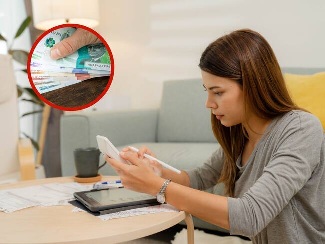 Mujer haciendo cuentas junto a unos billetes de diferente denominación (Fotos vía Getty Images)
