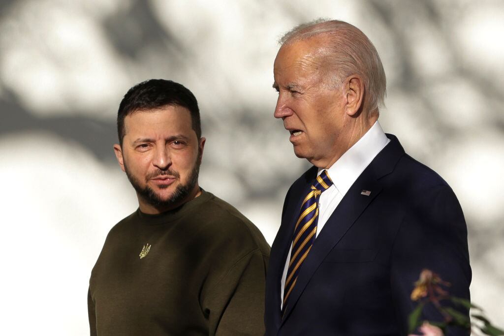 WASHINGTON, DC - DECEMBER 21: U.S. President Joe Biden (R) and President of Ukraine Volodymyr Zelensky walk down the Colonnade as they make their way to the Oval Office at the White House on December 21, 2022 in Washington, DC. Zelensky is meeting with President Biden on his first known trip outside of Ukraine since the Russian invasion began, and the two leaders are expected to discuss continuing military aid. Zelensky will reportedly address a joint meeting of Congress in the evening. (Photo by Alex Wong/Getty Images)