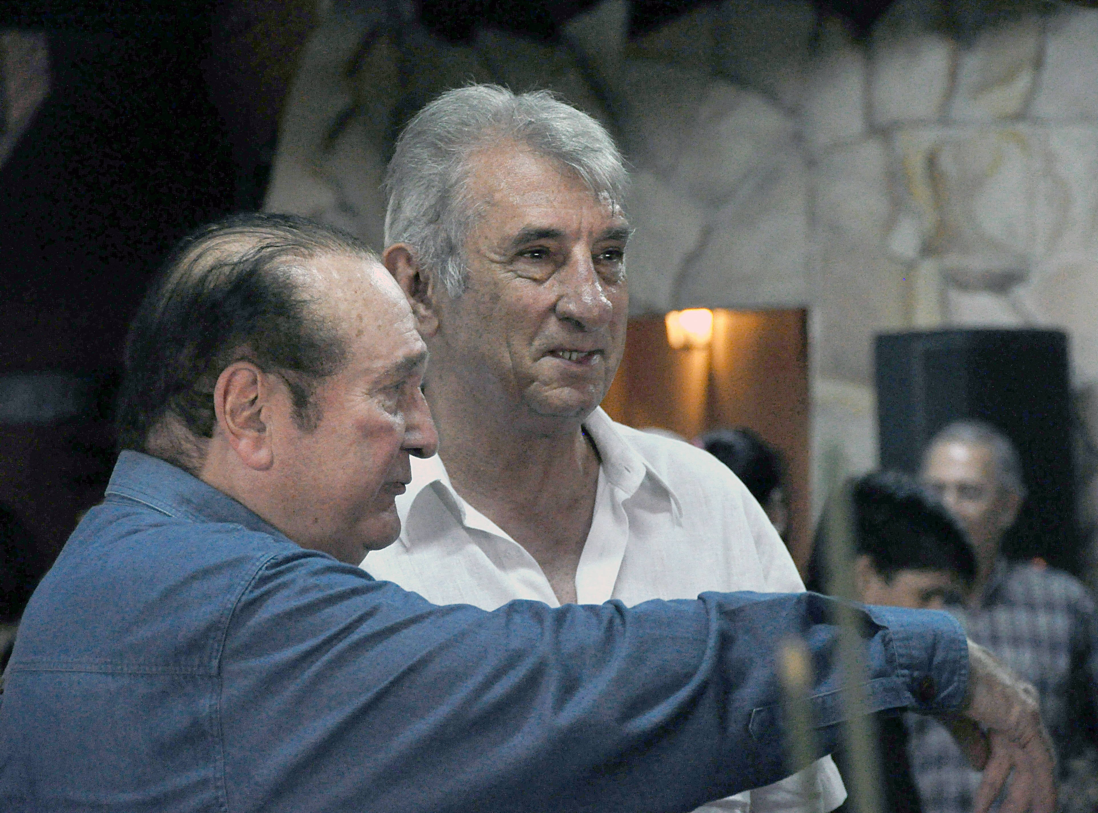 (FILES) CONMEBOL president Nicolas Leoz (L) speaks with former Argentine footballer Antonio Ubaldo Rattin during a meeting at Leoz's country residence, El Arriero, in Ypacarai, 40 km from Asuncion, on January 28, 2009. Former midfielder Antonio Ubaldo Rattin, regarded as one of the greatest idols in Boca Juniors' history, died on July 11, 2026, at the age of 89, according to the club. (Photo by NORBERTO DUARTE / AFP)