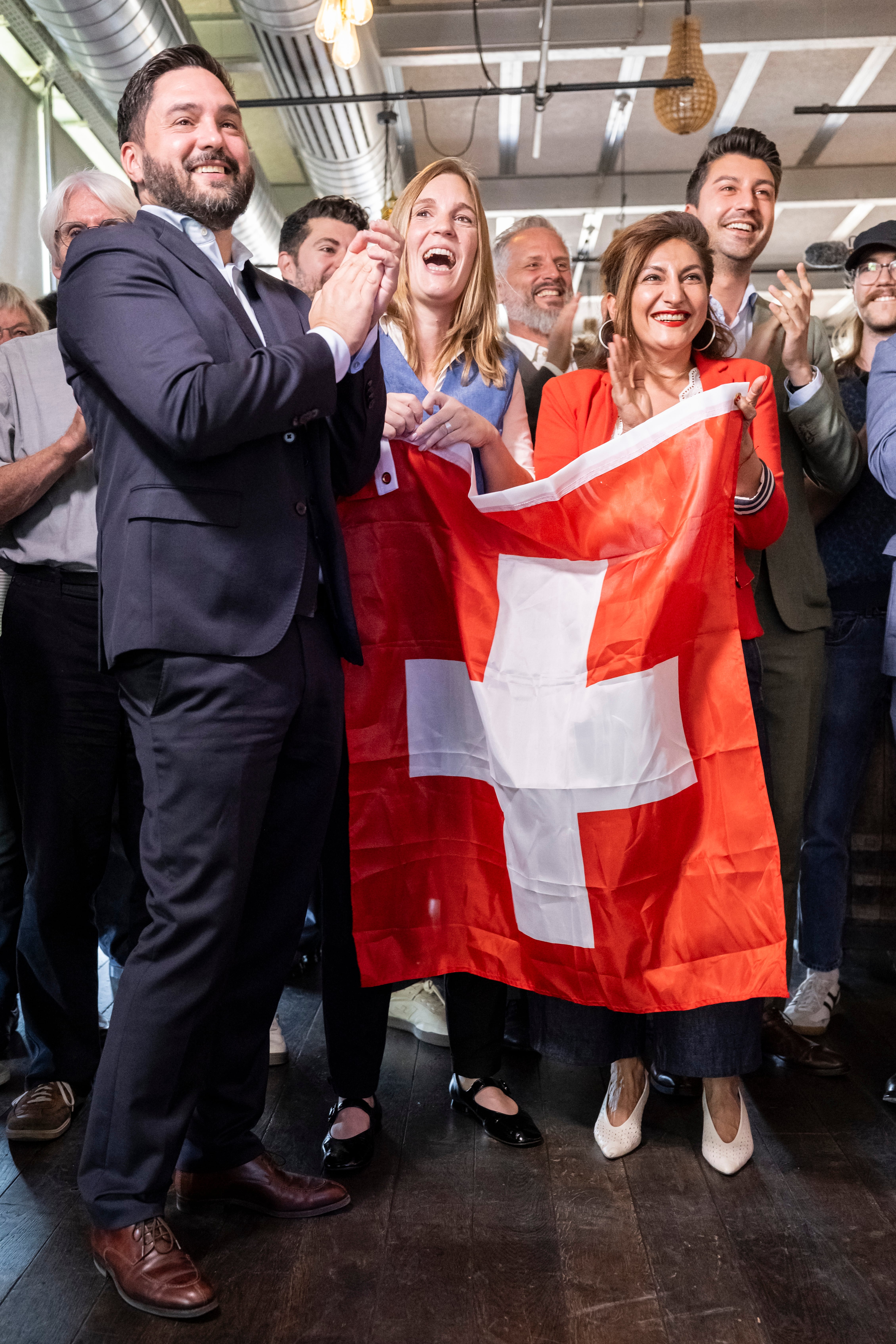 Bern (Switzerland), 27/09/2026.- (L-R) SP Co-President and National Council member Cedric Wermuth (SP-AG), National Council members Corina Gredig (GLP-ZH), and Sibel Arslan (GP-BS), and National Council member Fabian Molina (SP-ZH) react to the first clear projections at the vote-counting center of the nonpartisan 'No' committee against the referendum on 'Safeguard Swiss neutrality (Neutrality Initiative)', in Bern, Switzerland, 27 September 2026. (Suiza) EFE/EPA/ALESSANDRO DELLA VALLE