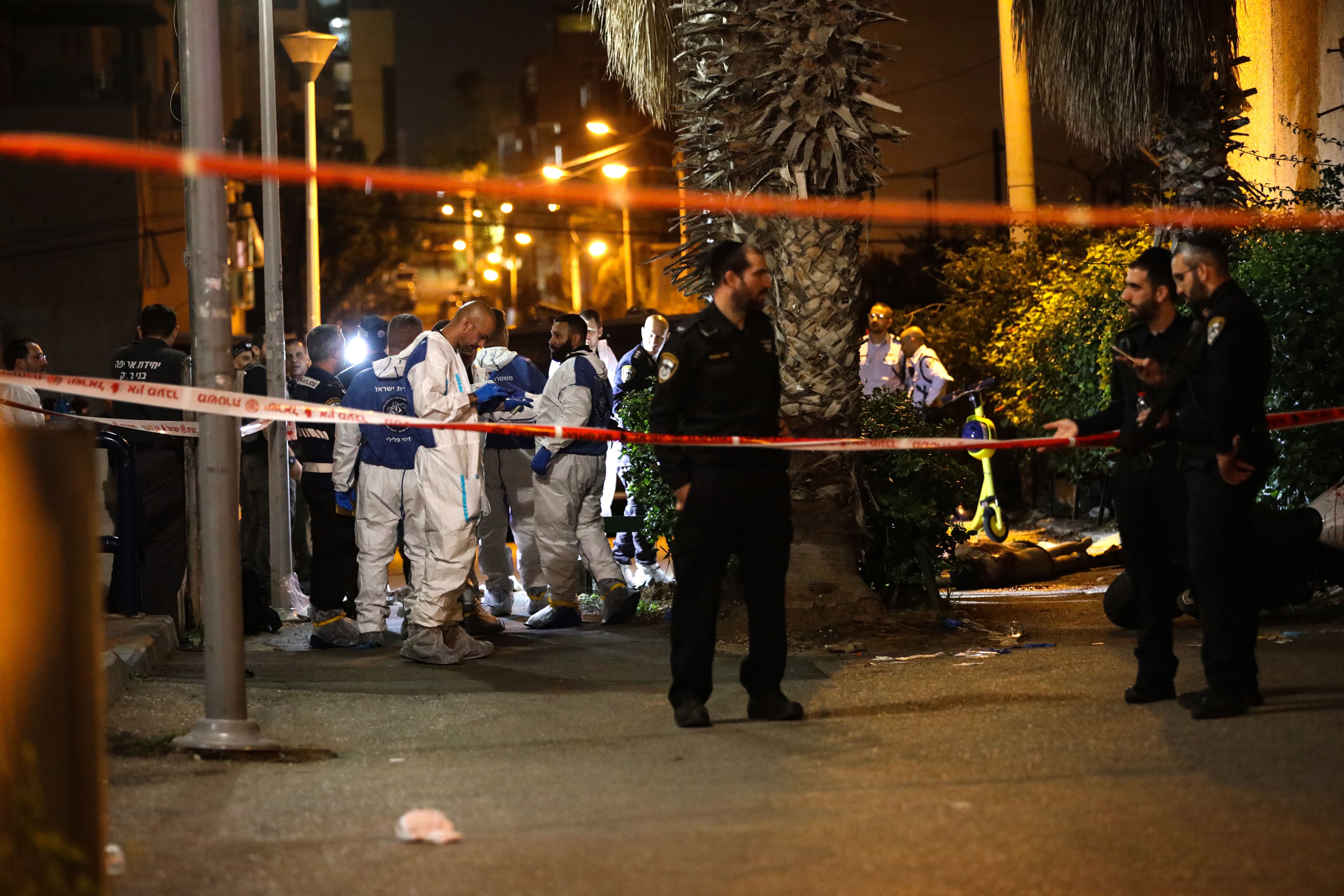 BNEI BRAK, ISRAEL - MARCH 29: (EDITORS NOTE: Image depicts graphic content) A dead body lies on the ground after five people were killed in a shooting attack in Bnei Brak east of Israel's Tel Aviv on March 29, 2022. (Photo by Mostafa Alkharouf/Anadolu Agency via Getty Images)