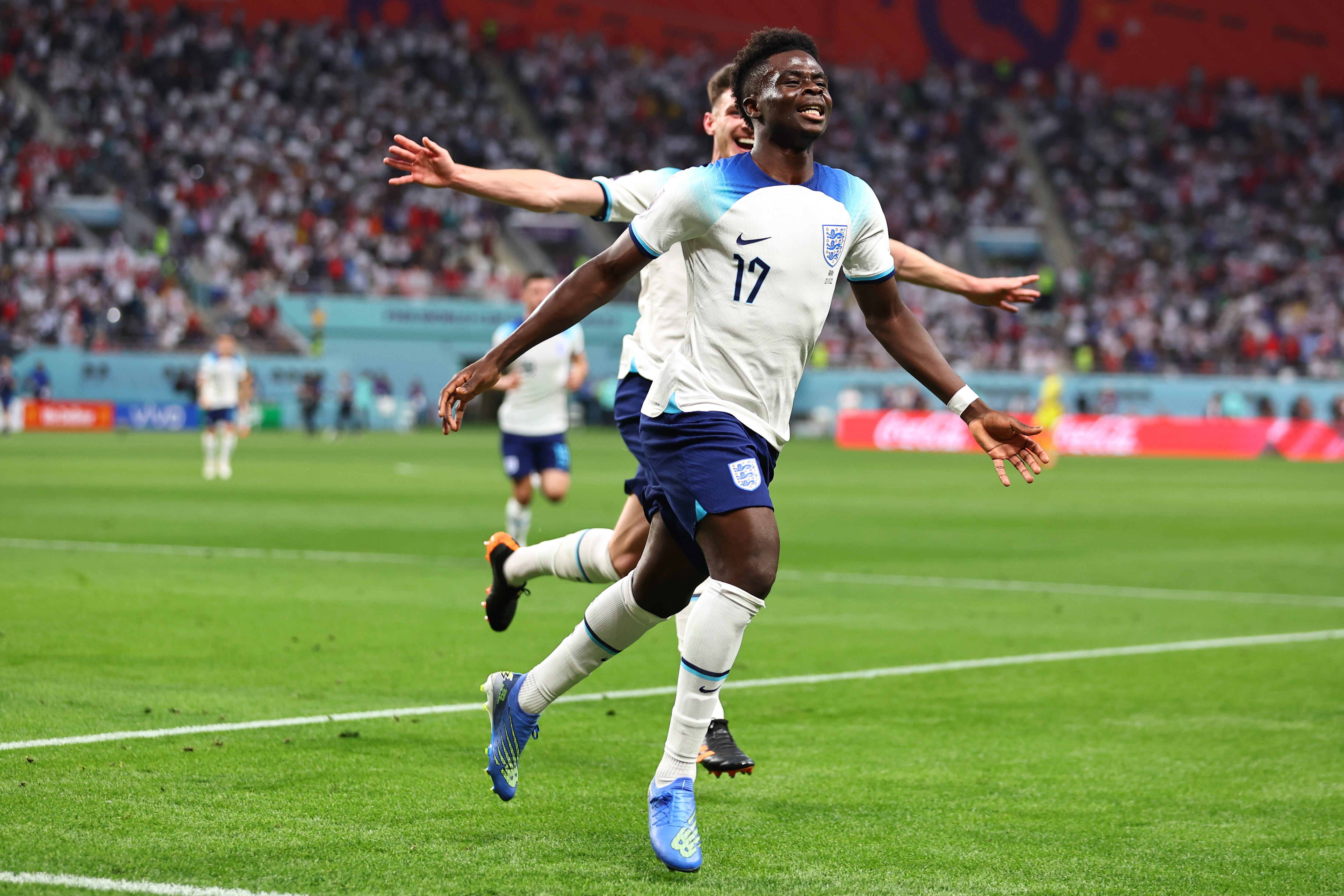 DOHA, QATAR - NOVEMBER 21: Bukayo Saka of England celebrates after scoring a goal to make it 2-0 during the FIFA World Cup Qatar 2022 Group B match between England and IR Iran at Khalifa International Stadium on November 21, 2022 in Doha, Qatar. (Photo by Robbie Jay Barratt - AMA/Getty Images)