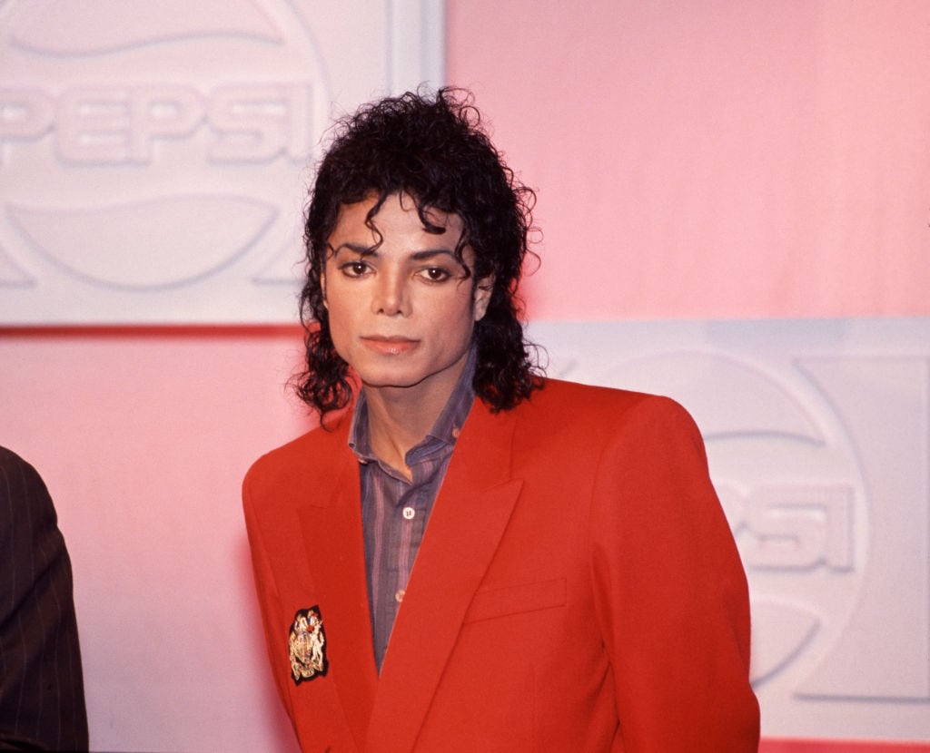 Portrait of American Pop and R&B singer Michael Jackson (1958 - 2009), dressed in a red blazer, New York, New York, 1988. (Photo by Rita Barros/Getty Images)