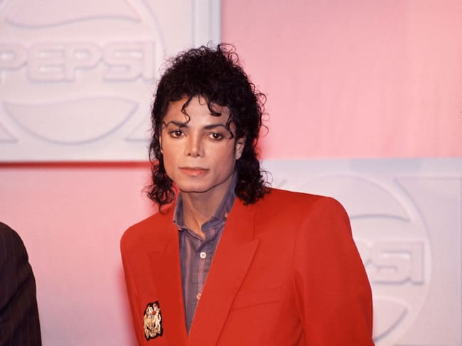 Portrait of American Pop and R&B singer Michael Jackson (1958 - 2009), dressed in a red blazer, New York, New York, 1988. (Photo by Rita Barros/Getty Images)