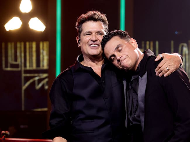 MIAMI, FLORIDA - NOVEMBER 13: (L-R) Honoree Carlos Vives and Silvestre Dangond perform onstage during the 2024 Latin Recording Academy Person of The Year Honoring Carlos Vives at Miami Beach Convention Center on November 13, 2024 in Miami, Florida. (Photo by John Parra/Getty Images for The Latin Recording Academy)