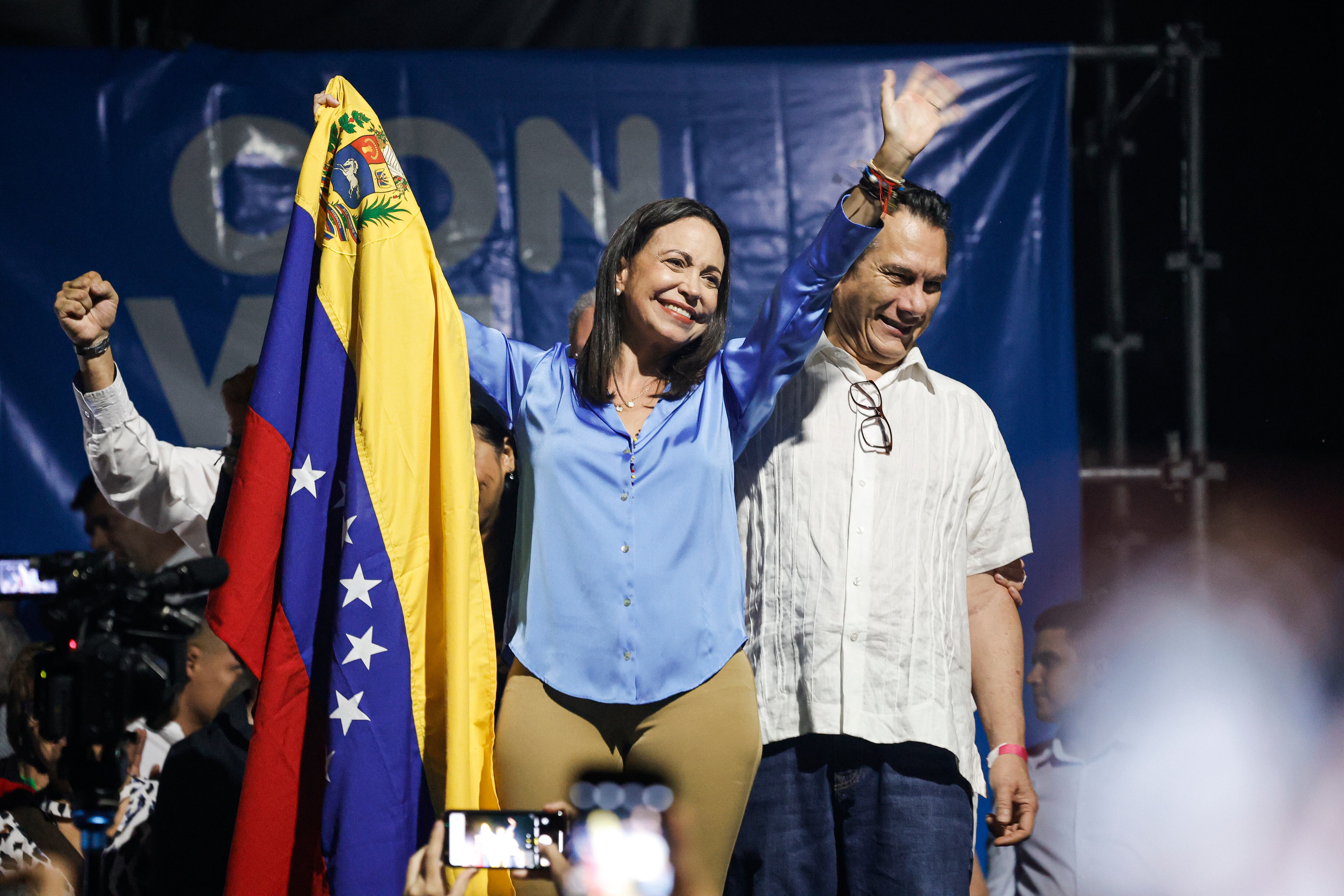 23 October 2023, Venezuela, Caracas: Maria Corina Machado, opposition presidential candidate, holds the Venezuelan flag as she waves to her supporters after receiving the results of the opposition primaries. Photo: Jesus Vargas/dpa (Photo by Jesus Vargas/picture alliance via Getty Images)