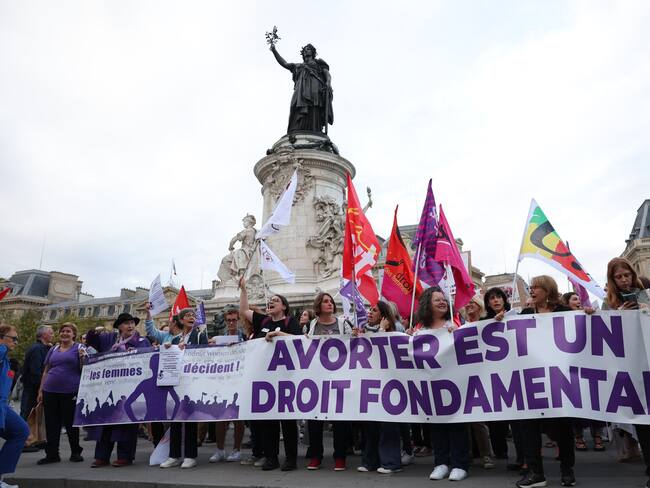 Women hold a banner reading &quot;Abortion is a fundamental right&quot; during a rally to support women&#039;s right to abortion on the occasion of the International Safe Abortion Day in Paris, on September 28, 2023. (Photo by Thomas SAMSON / AFP)